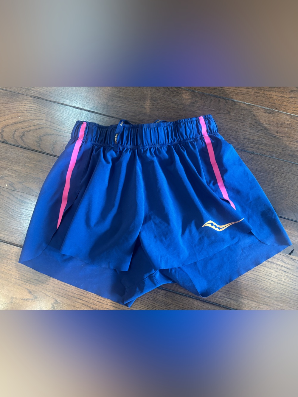 Saucony woman’s size small Blue Athletic Shorts with Pink Stripe running/racing